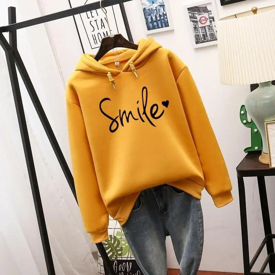 Woman wearing the Sigrid women's hooded sweater, detail view