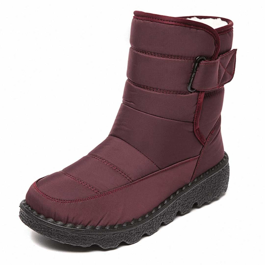 Woman wearing the Uma women's waterproof boots, side view