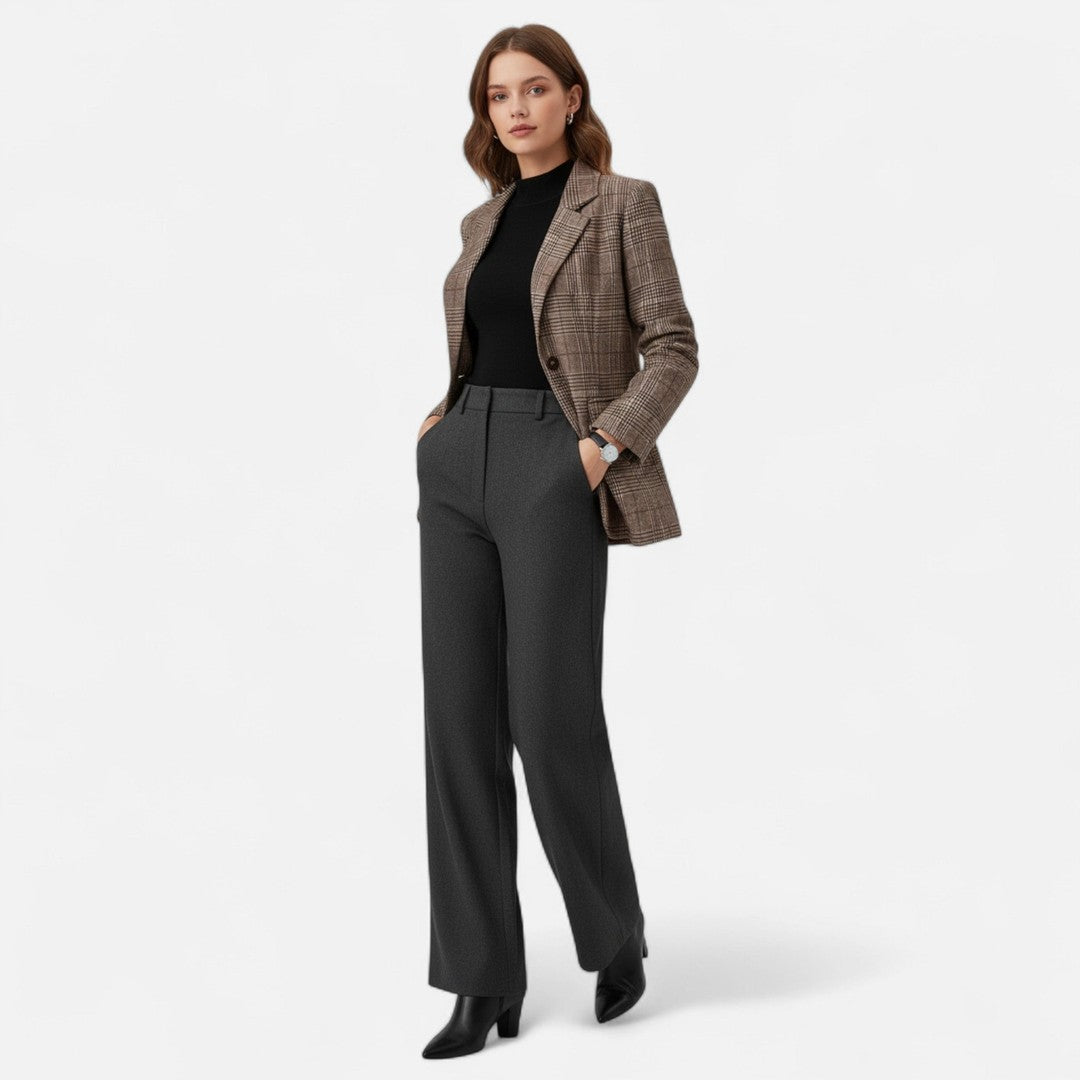 Woman wearing the Ursuline women's plaid blazer, back view