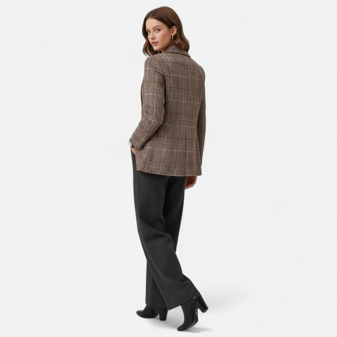 Woman wearing the Ursuline women's plaid blazer, side view