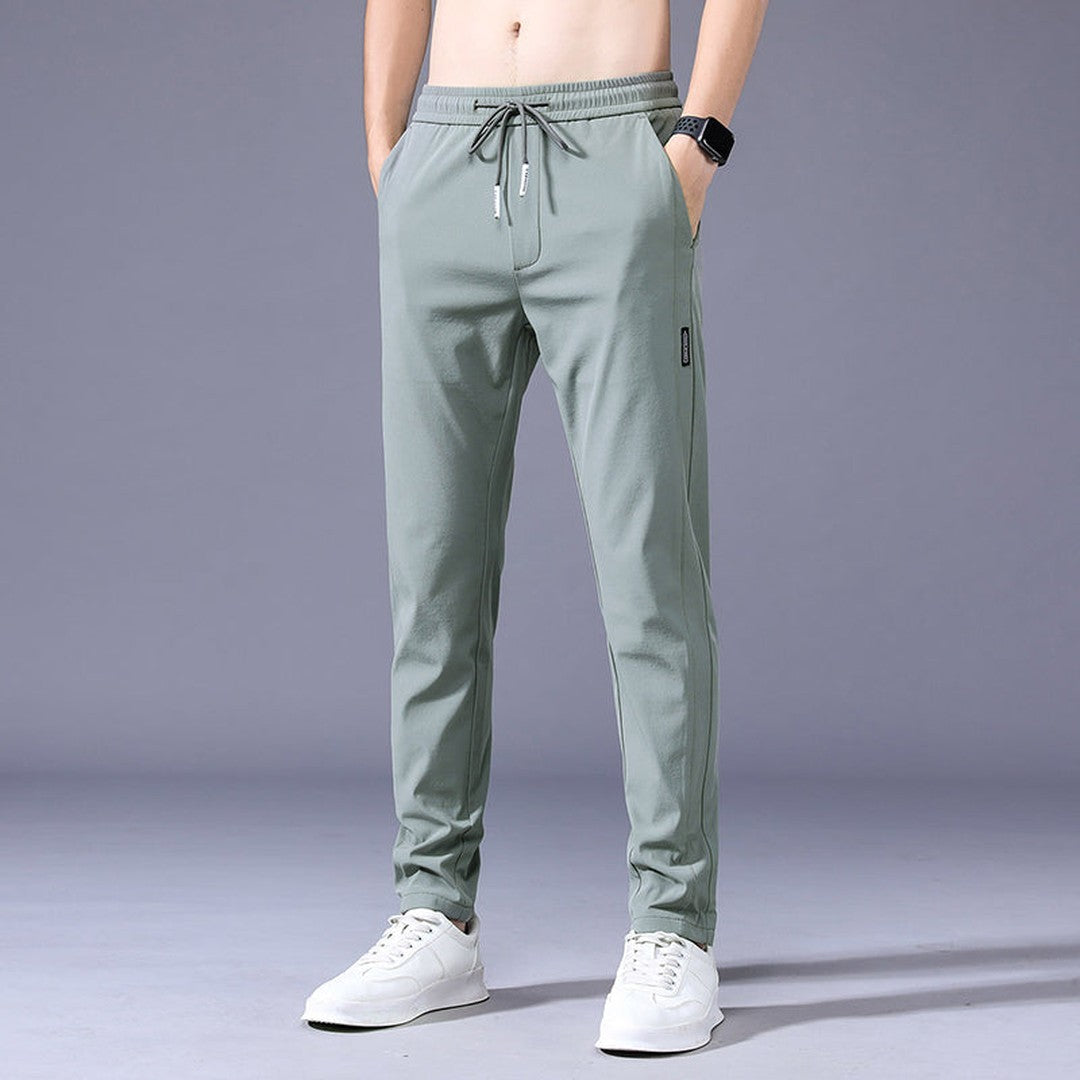 Man wearing the Vincent men's stretch pants, flatlay view