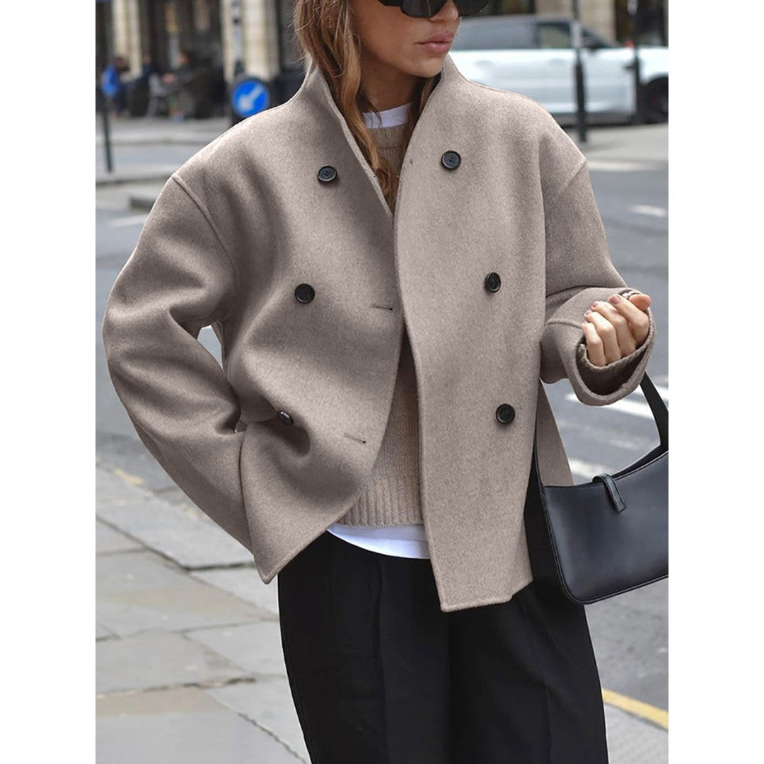 Woman wearing the Wilhelmina women's cropped mock-neck button-up jacket in beige, model view