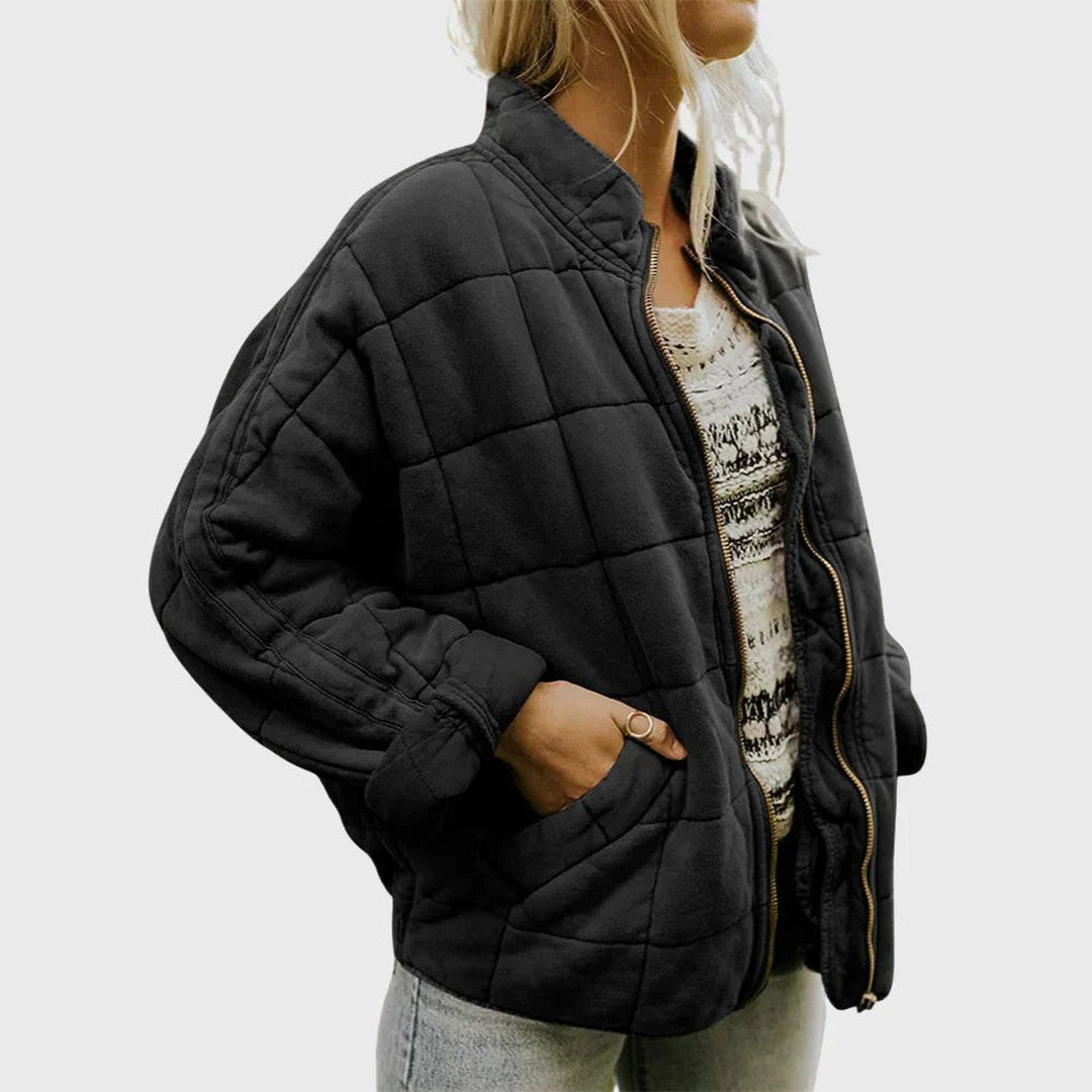 Man wearing the Wolfgang men's quilted jacket, side view