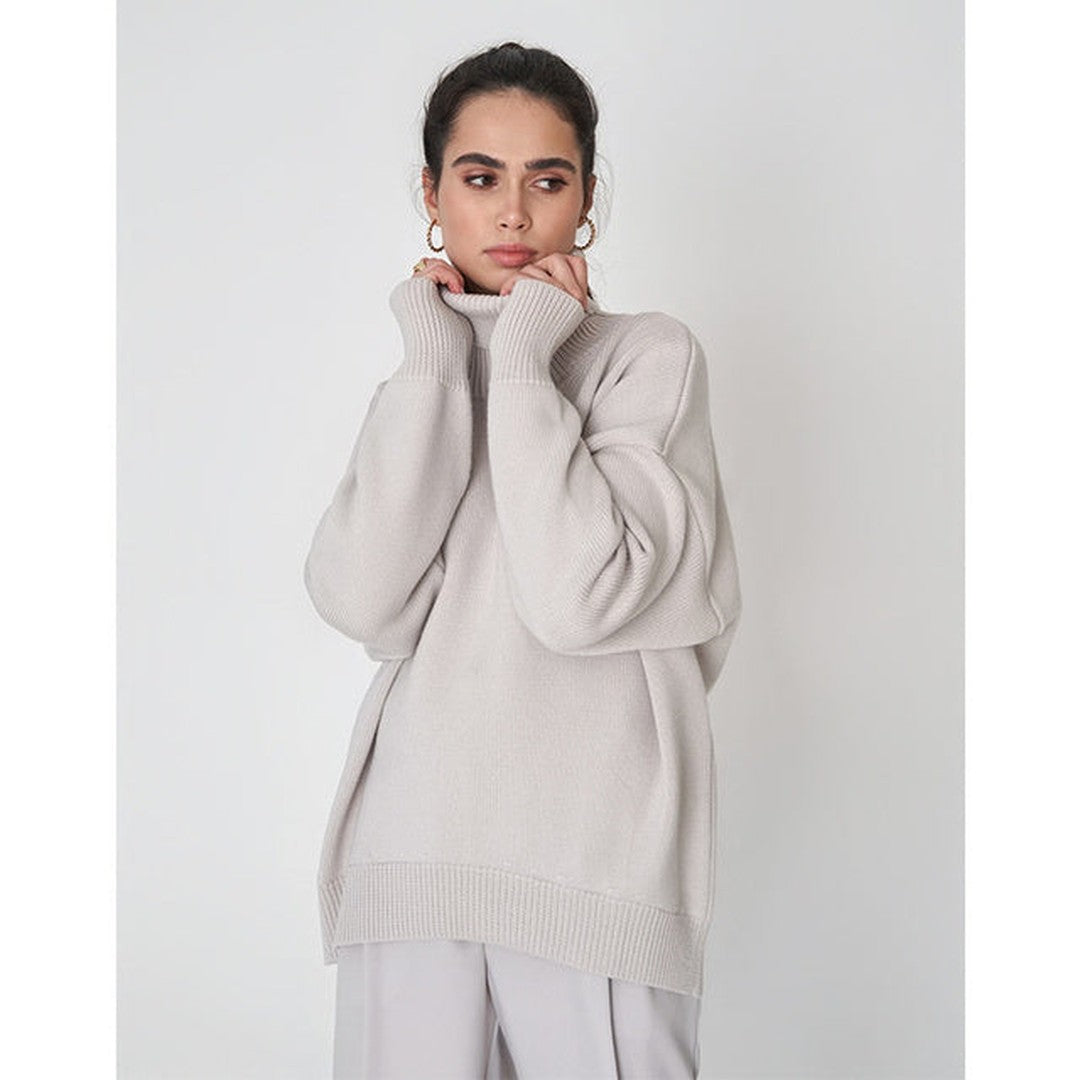 Woman wearing the Xanthe women's turtleneck knit sweater, 7 view