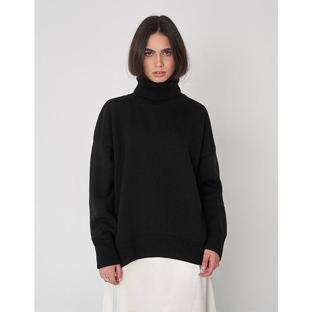 Woman wearing the Xanthe women's turtleneck knit sweater, front view