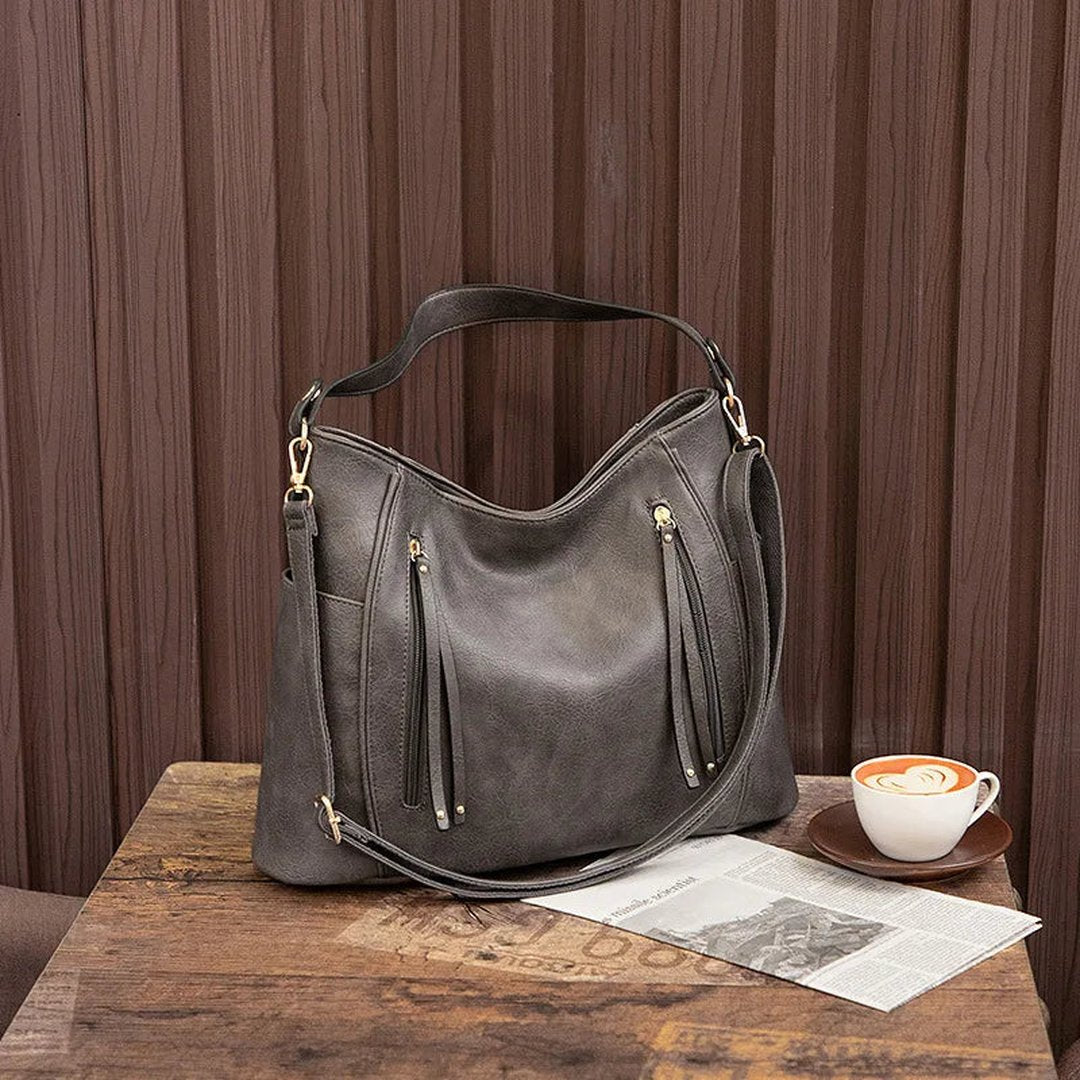 Woman wearing the Ximena women's elegant bag, back view