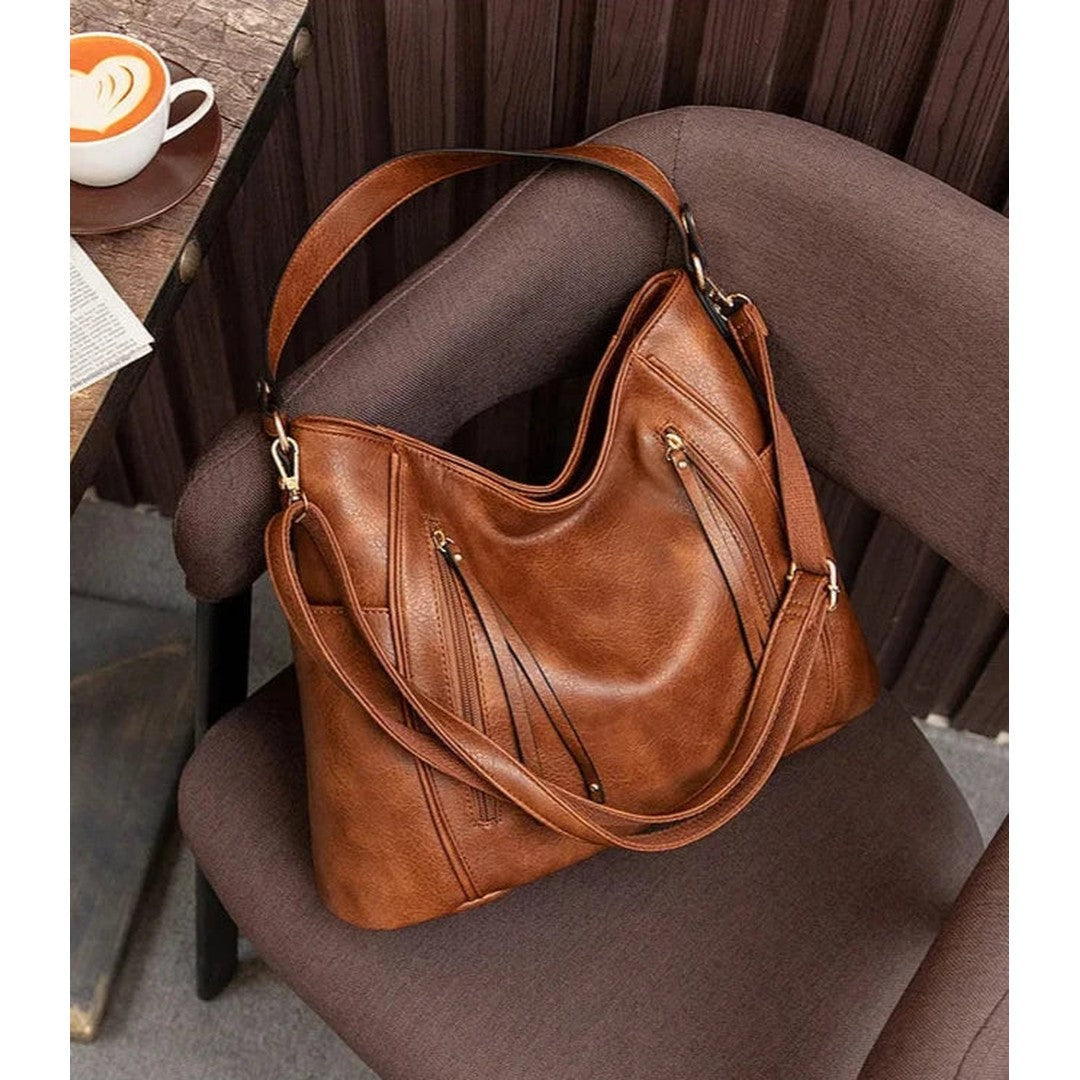 Woman wearing the Ximena women's elegant bag, side view