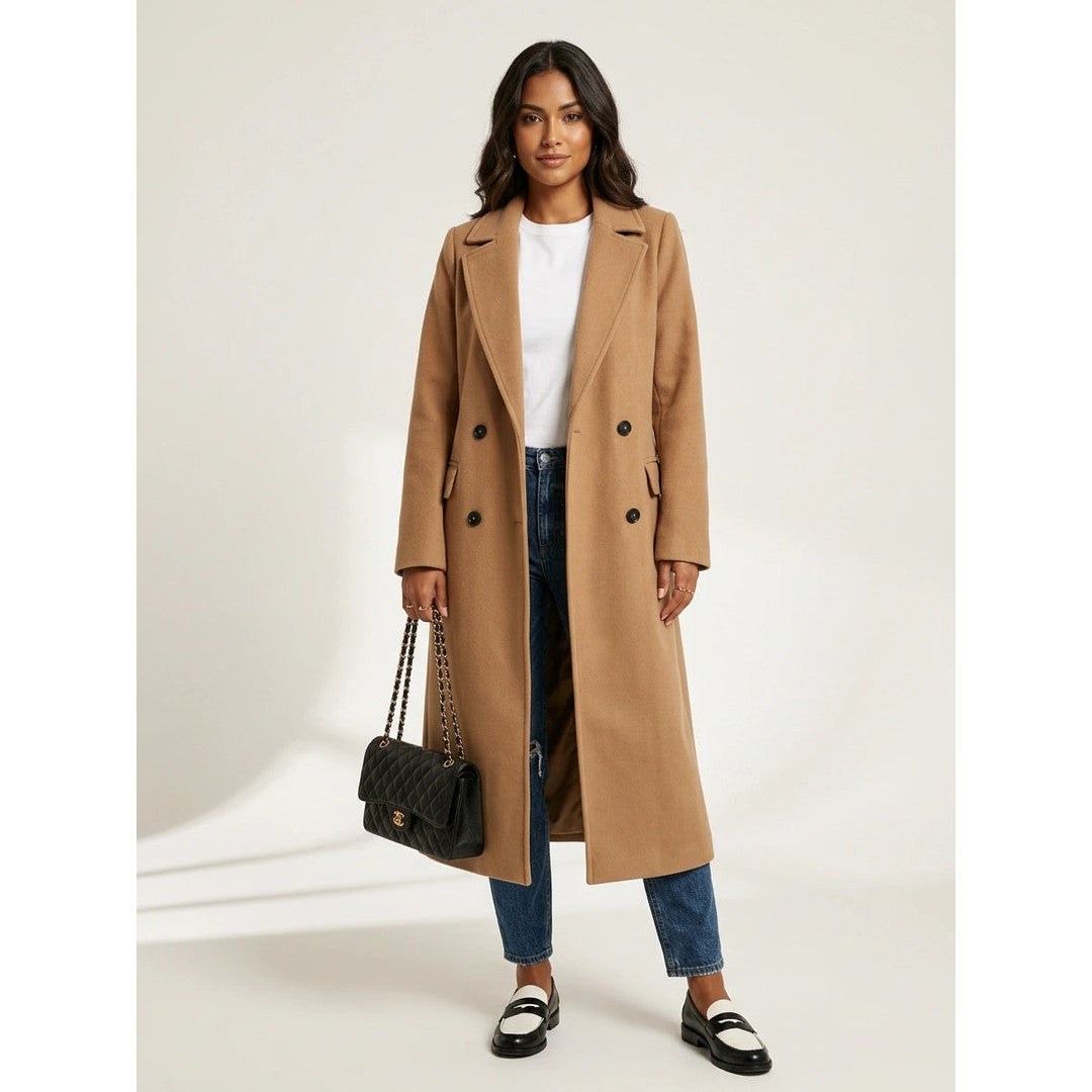 Woman wearing the Ylva women's long-sleeve coat, flatlay view