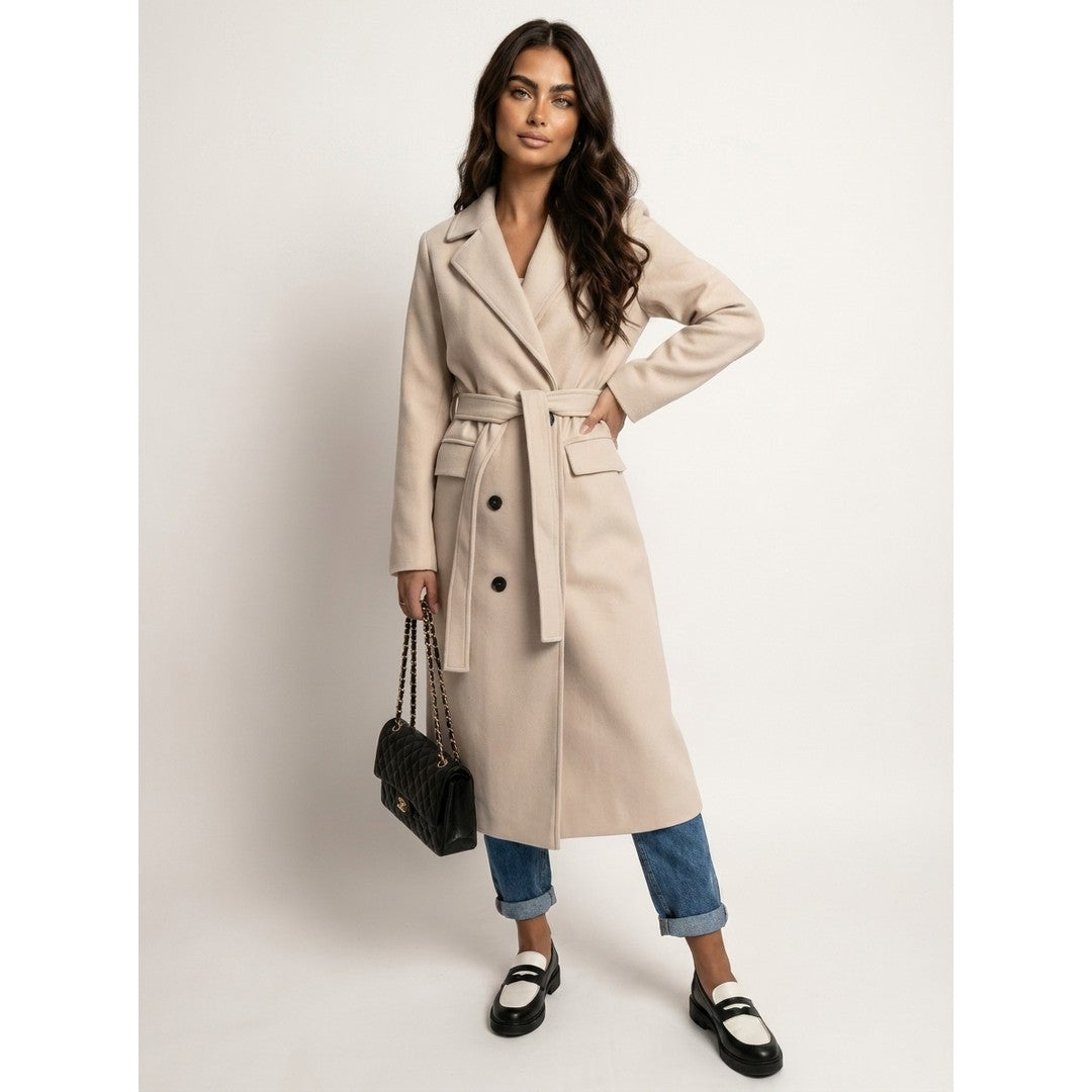Woman wearing the Ylva women's long-sleeve coat, front view