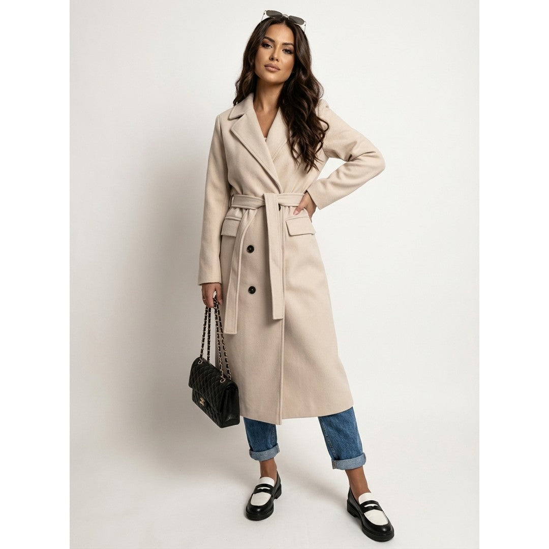 Woman wearing the Ylva women's long-sleeve coat, side view