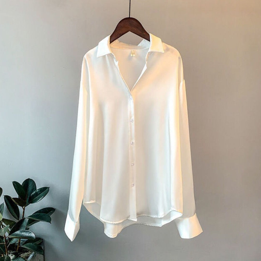 Woman wearing the Zinnia women's satin shirt, detail view