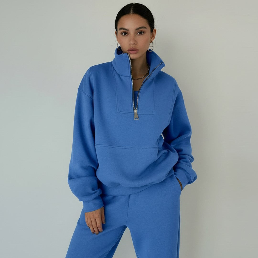 Woman wearing the Zita women's sporty hoodie, flatlay view