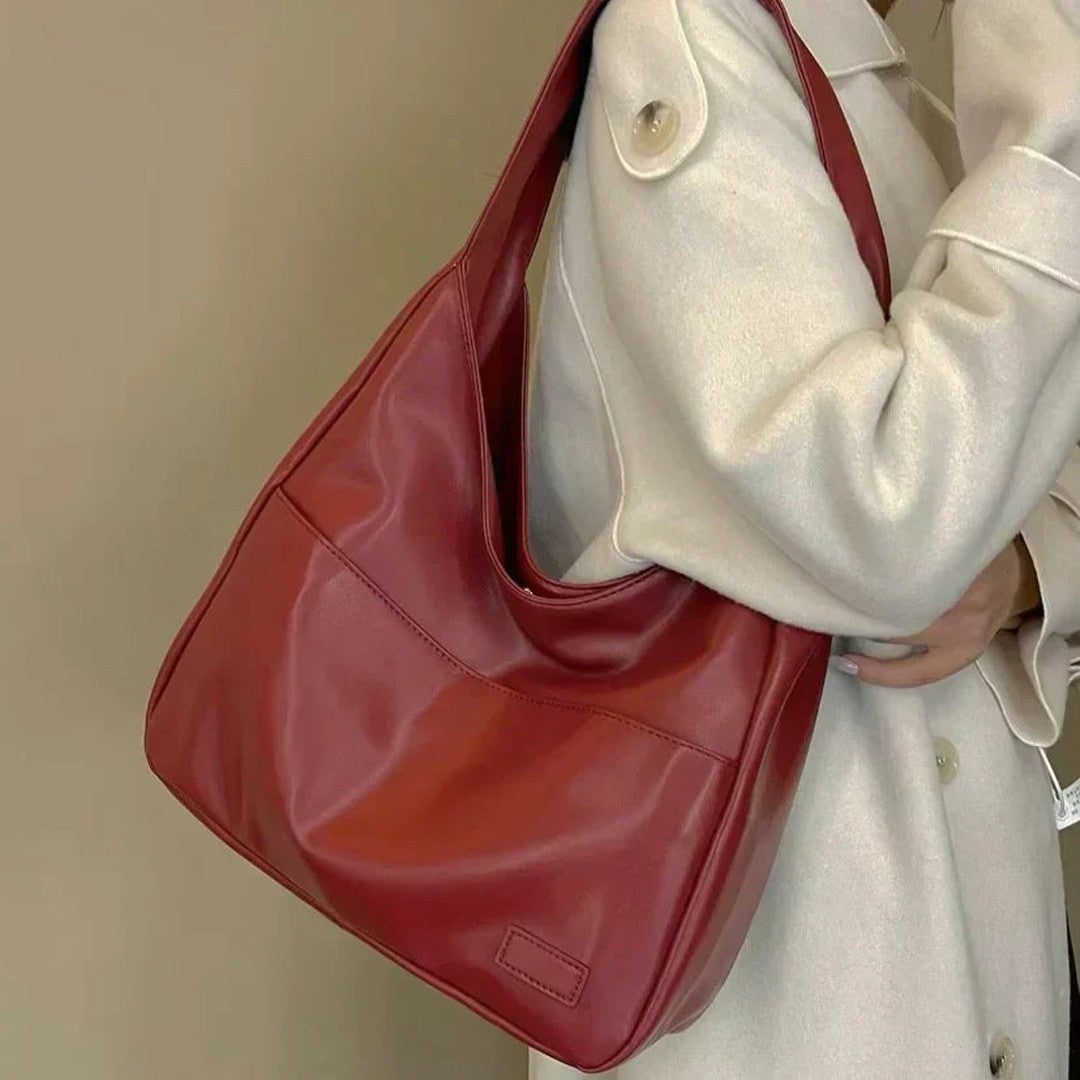 Woman wearing the Zosia women's pocket detail bag, back view