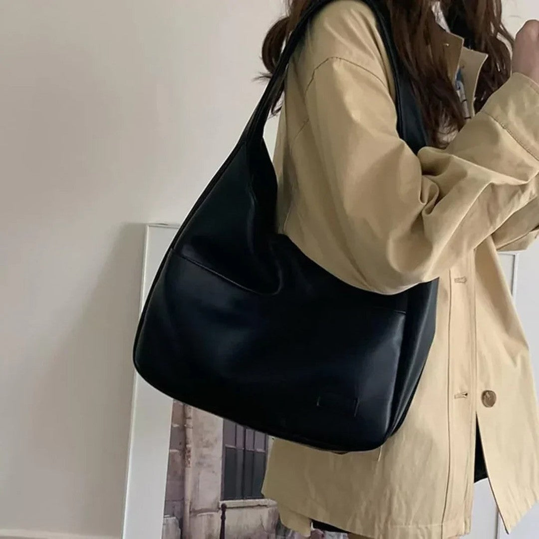 Woman wearing the Zosia women's pocket detail bag, detail view