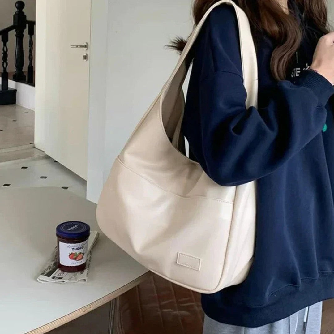 Woman wearing the Zosia women's pocket detail bag, model view